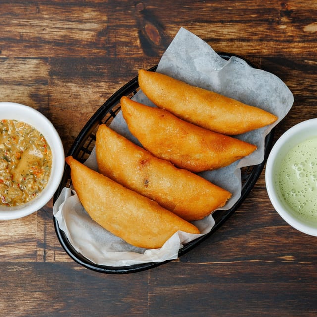 FREE (2) Empanadas w/$30+ Purchase.